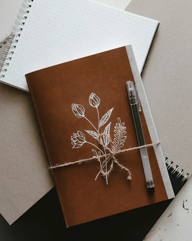 Brown and white book on white paper